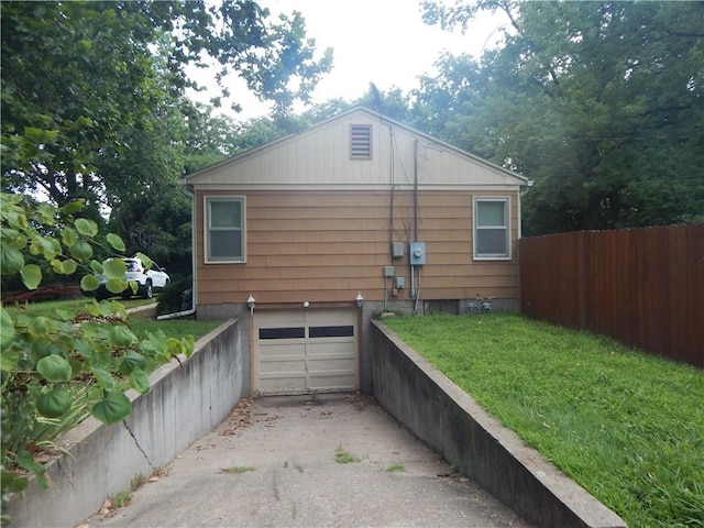 2031 Spruce St, Leavenworth, KS 66048 - view of home's exterior with a garage and driveway