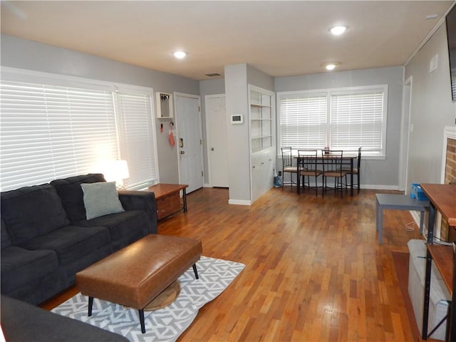 2031 Spruce St, Leavenworth, KS 66048 - living area featuring wood finished floors and recessed lighting