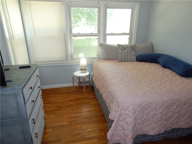 2031 Spruce St, Leavenworth, KS 66048 - bedroom with wood finished floors and multiple windows