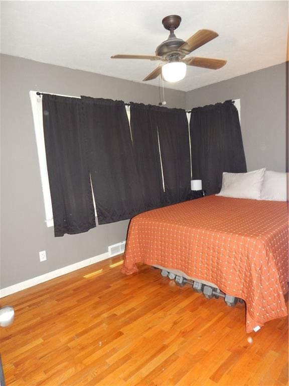2031 Spruce St, Leavenworth, KS 66048 - bedroom with wood finished floors and a ceiling fan