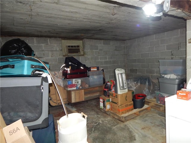 2031 Spruce St, Leavenworth, KS 66048 - basement with concrete block wall and a wall mounted air conditioner