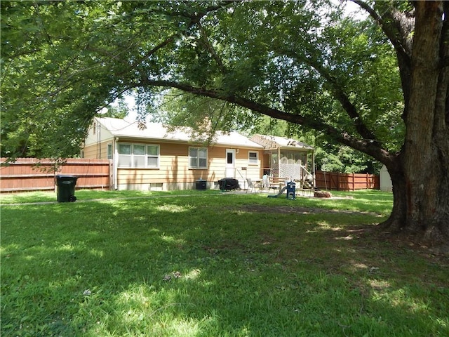 2031 Spruce St, Leavenworth, KS 66048 - back of house with a fenced backyard