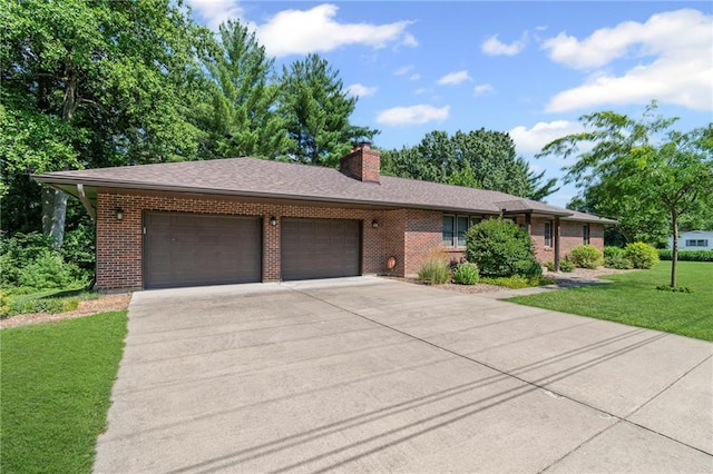 1306 Ruby St, Carrollton, MO 64633 - single story home with an attached garage, driveway, brick siding, and a front yard