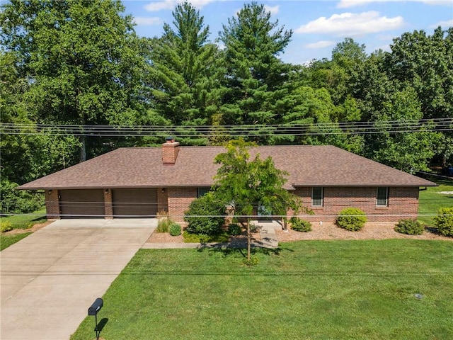 1306 Ruby St, Carrollton, MO 64633 - single story home featuring concrete driveway, a garage, brick siding, a front yard, and a shingled roof