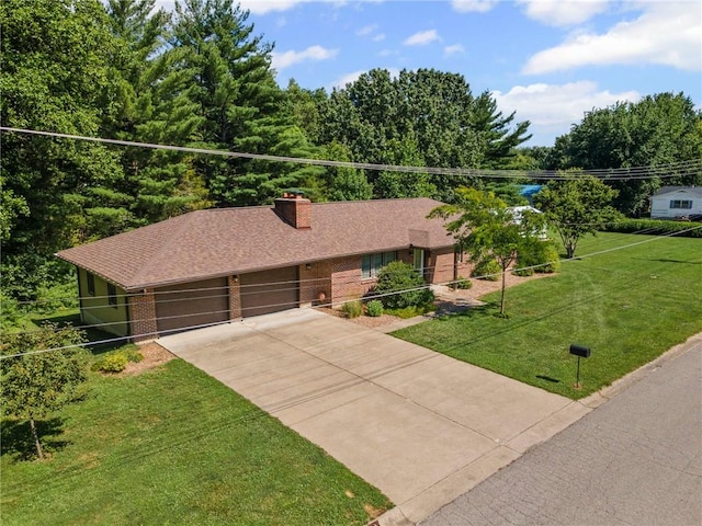 1306 Ruby St, Carrollton, MO 64633 - ranch-style home featuring a garage, concrete driveway, a front lawn, a chimney, and brick siding