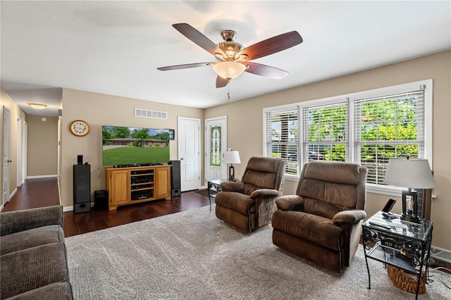 1306 Ruby St, Carrollton, MO 64633 - living room with ceiling fan and dark wood-style floors