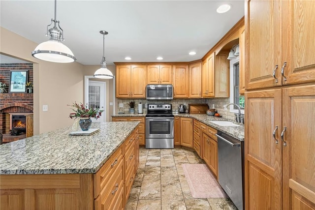 1306 Ruby St, Carrollton, MO 64633 - kitchen with appliances with stainless steel finishes, tasteful backsplash, stone tile flooring, light stone counters, and recessed lighting