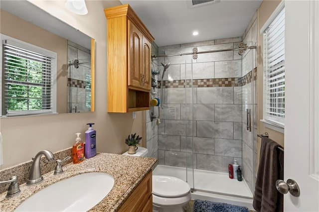 1306 Ruby St, Carrollton, MO 64633 - bathroom with a shower stall, vanity, and recessed lighting