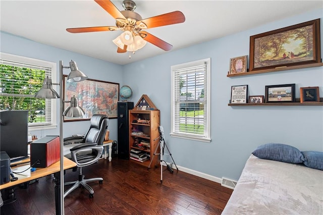 1306 Ruby St, Carrollton, MO 64633 - office area featuring plenty of natural light, wood finished floors, and a ceiling fan