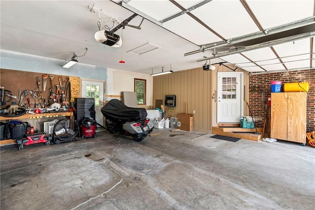 1306 Ruby St, Carrollton, MO 64633 - garage with a garage door opener and heating unit