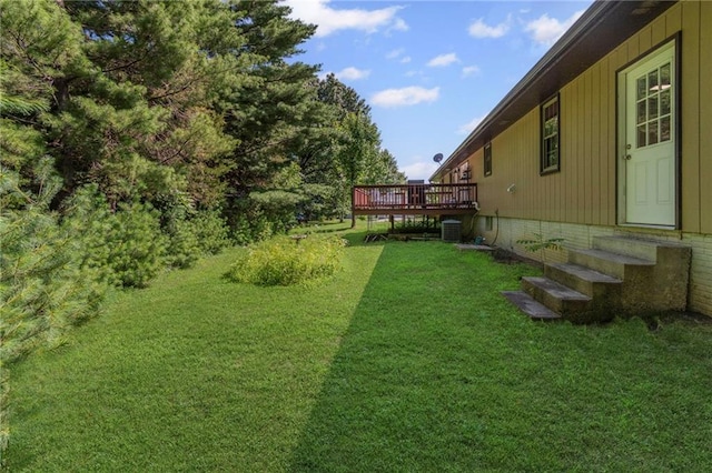 1306 Ruby St, Carrollton, MO 64633 - view of green lawn featuring a deck and entry steps