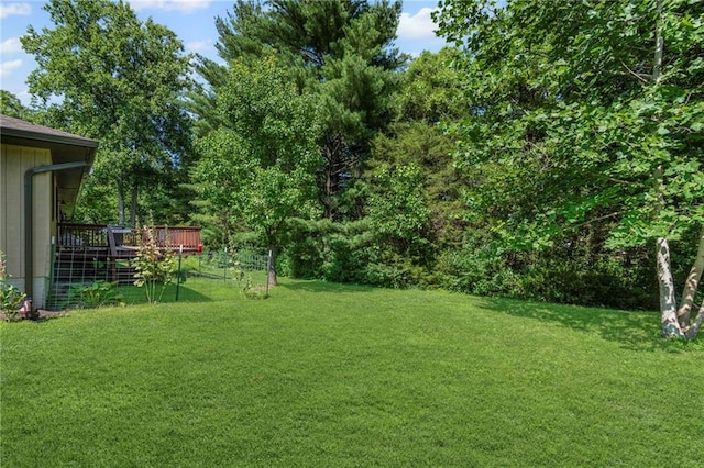 1306 Ruby St, Carrollton, MO 64633 - view of green lawn featuring a wooden deck