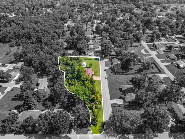 1306 Ruby St, Carrollton, MO 64633 - aerial view of residential area with a forest and property parcel outlined