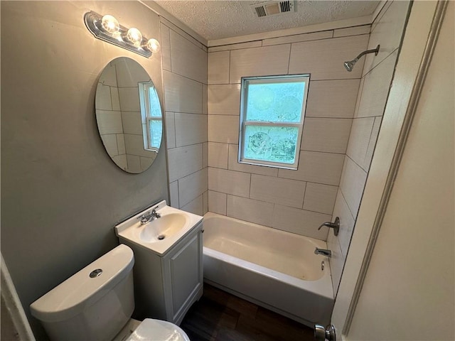 6146 Parkview Ave, Kansas City, KS 66104 - full bathroom featuring vanity, a textured ceiling, shower / tub combination, and wood finished floors