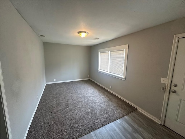 6146 Parkview Ave, Kansas City, KS 66104 - empty room featuring baseboards and dark wood-type flooring