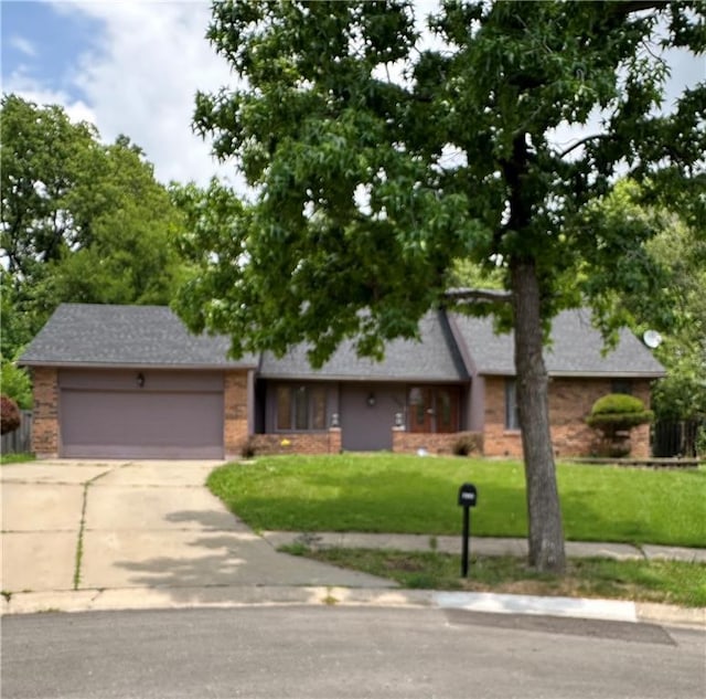 7908 E 96th St, Kansas City, MO 64134 - single story home featuring brick siding, an attached garage, a front yard, driveway, and a shingled roof