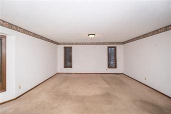 7908 E 96th St, Kansas City, MO 64134 - unfurnished room with light carpet and baseboards