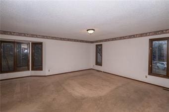 7908 E 96th St, Kansas City, MO 64134 - carpeted empty room featuring baseboards