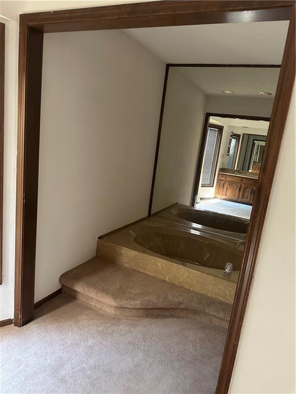 7908 E 96th St, Kansas City, MO 64134 - stairs featuring carpet and baseboards