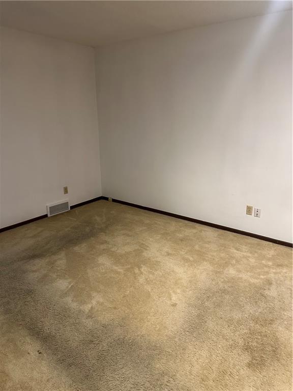 7908 E 96th St, Kansas City, MO 64134 - unfurnished room with carpet