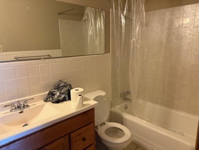 2302 Crawford Ave, Parsons, KS 67357 - full bathroom with shower / bathtub combination with curtain, vanity, and tile walls