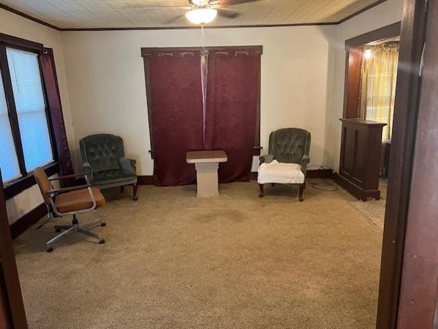 1110 W Main St, Chanute, KS 66720 - sitting room with crown molding, ceiling fan, and light colored carpet