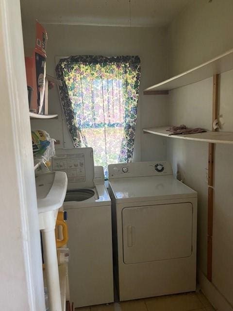 1110 W Main St, Chanute, KS 66720 - washroom featuring washing machine and dryer and light tile patterned flooring