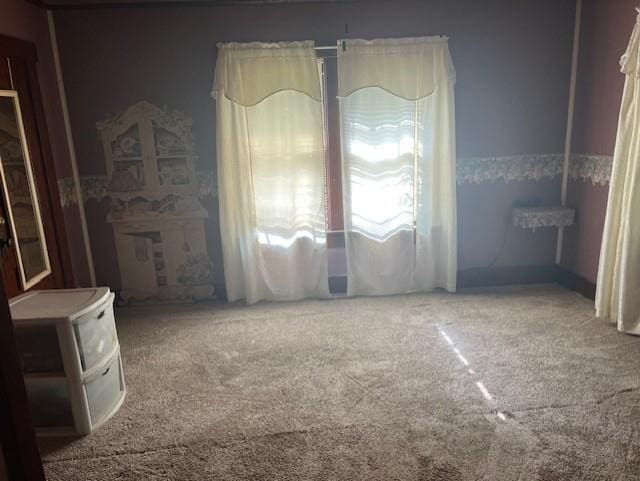 1110 W Main St, Chanute, KS 66720 - unfurnished bedroom featuring carpet floors