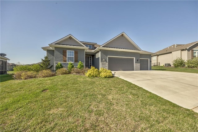 4246 Lakeview Ter, Basehor, KS 66007 - craftsman-style home featuring stone siding, a garage, a front yard, and driveway