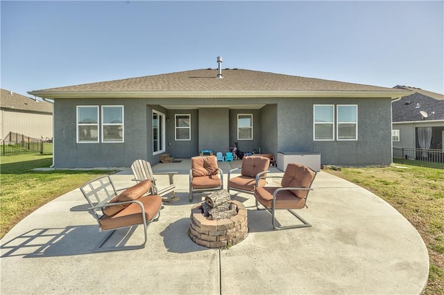 4246 Lakeview Ter, Basehor, KS 66007 - rear view of house featuring a patio area, stucco siding, and an outdoor living space with a fire pit