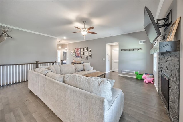 4246 Lakeview Ter, Basehor, KS 66007 - living room featuring ceiling fan, crown molding, wood finished floors, and a fireplace
