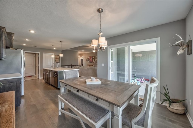 4246 Lakeview Ter, Basehor, KS 66007 - dining room featuring dark wood-style flooring, a chandelier, and recessed lighting