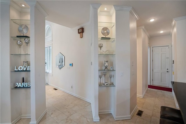 1702 Cedar Ridge Rd, Parsons, KS 67357 - corridor featuring built in features, crown molding, recessed lighting, and light marble finish flooring