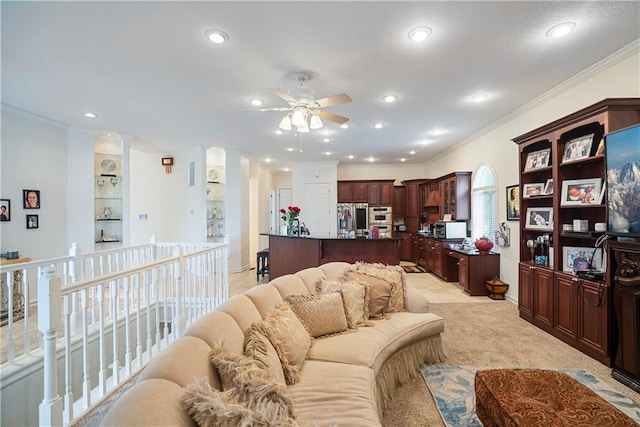 1702 Cedar Ridge Rd, Parsons, KS 67357 - living room featuring a ceiling fan, recessed lighting, crown molding, and light colored carpet