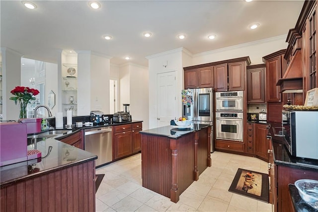 1702 Cedar Ridge Rd, Parsons, KS 67357 - kitchen featuring a kitchen island, ornamental molding, stainless steel appliances, custom range hood, and dark stone counters