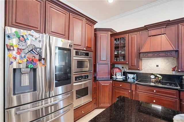 1702 Cedar Ridge Rd, Parsons, KS 67357 - kitchen with stainless steel appliances, crown molding, decorative backsplash, dark stone countertops, and glass insert cabinets