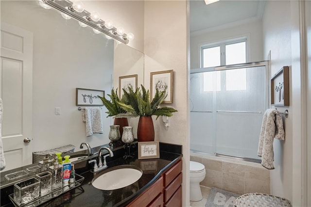 1702 Cedar Ridge Rd, Parsons, KS 67357 - bathroom with combined bath / shower with glass door, vanity, and crown molding