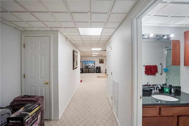 1702 Cedar Ridge Rd, Parsons, KS 67357 - hall featuring a paneled ceiling and a sink