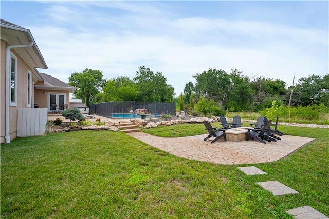 1702 Cedar Ridge Rd, Parsons, KS 67357 - view of yard with french doors, a patio, and an outdoor fire pit