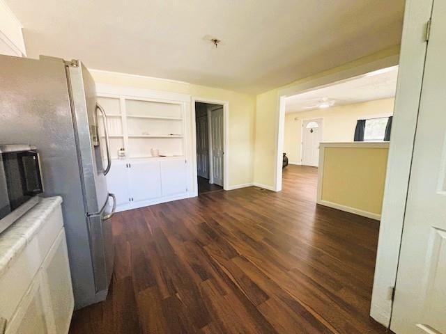621 N 3rd St, Burlington, KS 66839 - interior space with dark wood-type flooring, stainless steel appliances, and built in features
