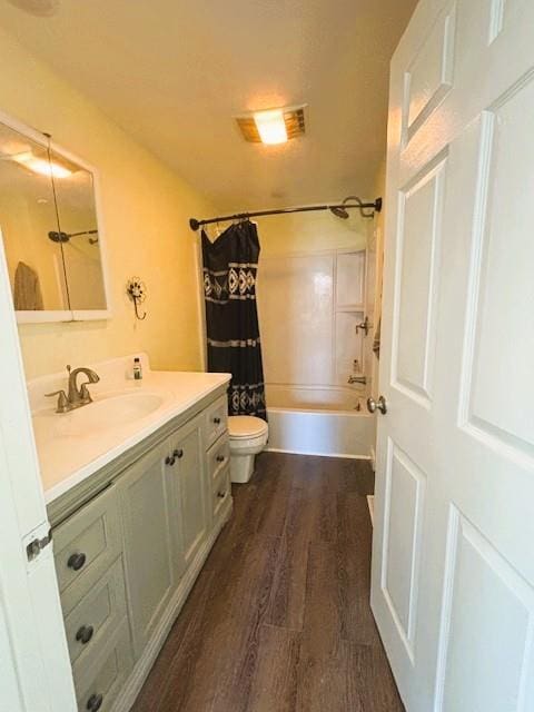 621 N 3rd St, Burlington, KS 66839 - full bathroom featuring vanity, wood finished floors, and shower / tub combo