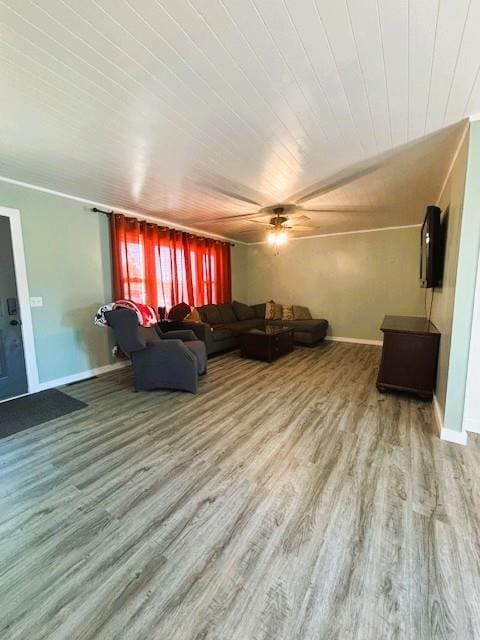 143 N 3rd St, New Strawn, KS 66839 - living area with wood finished floors, wooden ceiling, and a ceiling fan