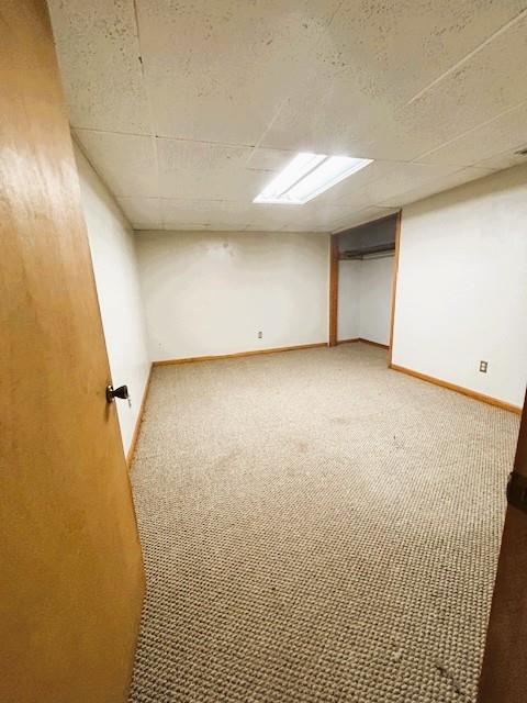 143 N 3rd St, New Strawn, KS 66839 - finished basement featuring carpet floors and a drop ceiling