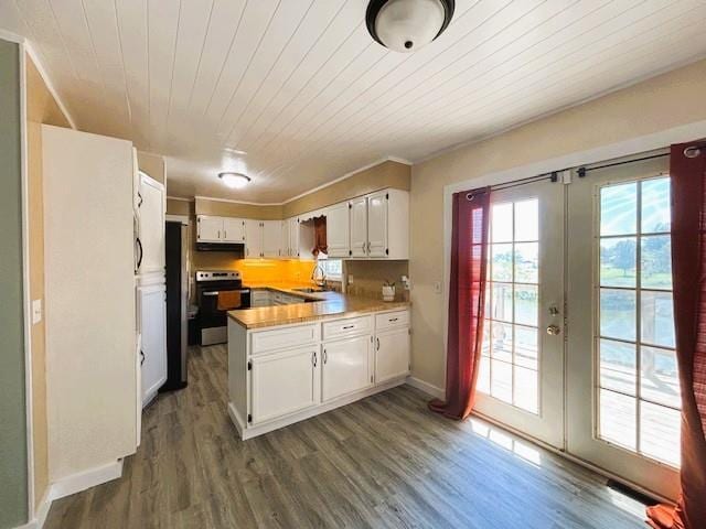 143 N 3rd St, New Strawn, KS 66839 - kitchen with a peninsula, stainless steel electric range oven, french doors, white cabinets, and wooden ceiling