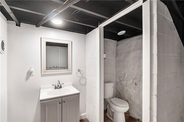 4001 Tracy Ave, Kansas City, MO 64110 - bathroom with vanity and wood finished floors