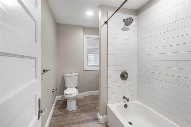 4001 Tracy Ave, Kansas City, MO 64110 - bathroom with wood finished floors and tub / shower combination