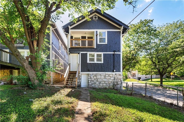 4001 Tracy Ave, Kansas City, MO 64110 - view of front of house with a balcony and stairs