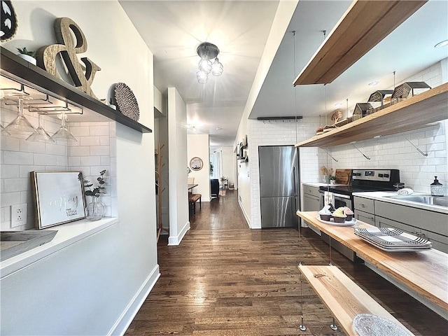 1643 Jefferson St, Kansas City, MO 64108 - hallway featuring dark wood-type flooring and baseboards