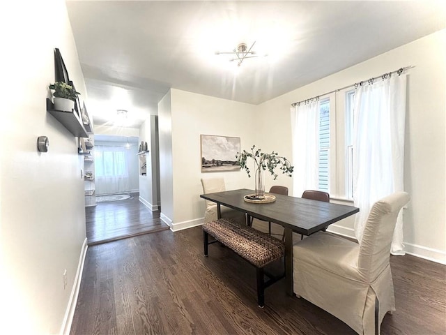 1643 Jefferson St, Kansas City, MO 64108 - dining room featuring dark wood-style flooring and a chandelier