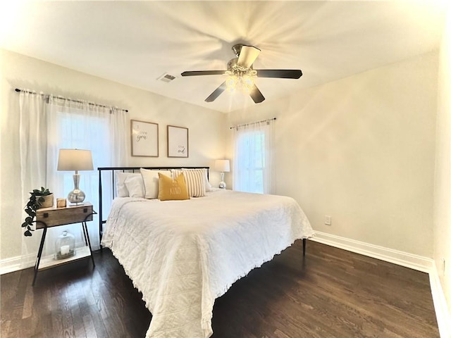 1643 Jefferson St, Kansas City, MO 64108 - bedroom featuring dark wood finished floors and ceiling fan